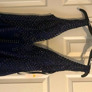 The pictures don’t do it justice. Dark blue low cut slit dress